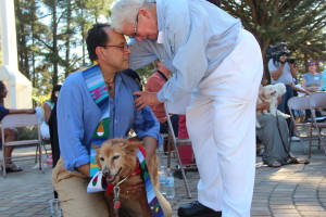 Babbitt blesses an owner and his dog. Babbitt said Saint Francis of Assisi, the patron saint of animals, renounced his wealth and swore to bless every animal he saw. Photo by Sanosi Osman.