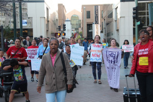 Supporters of the Tenant Protection Ordinance march into Oakland City Hall.