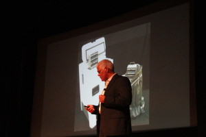 Shashi Buluswar introduced a solar refrigerator to the audience.