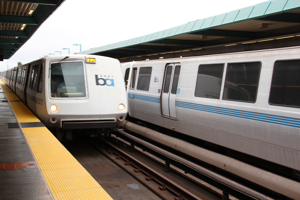 BART trains resume running at the West Oakland BART station after a train was held Thursday morning as policed searched for a suspected armed