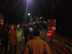 By 9:30 pm, much of the crowd had dispersed, but some protesters headed back towards the freeway. Photo by Alex Kekauoha.