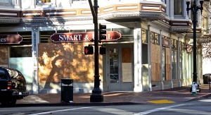 At the Smart & Final grocery store nearly every window was broken and boarded. Photo by Jacqui Ipp.