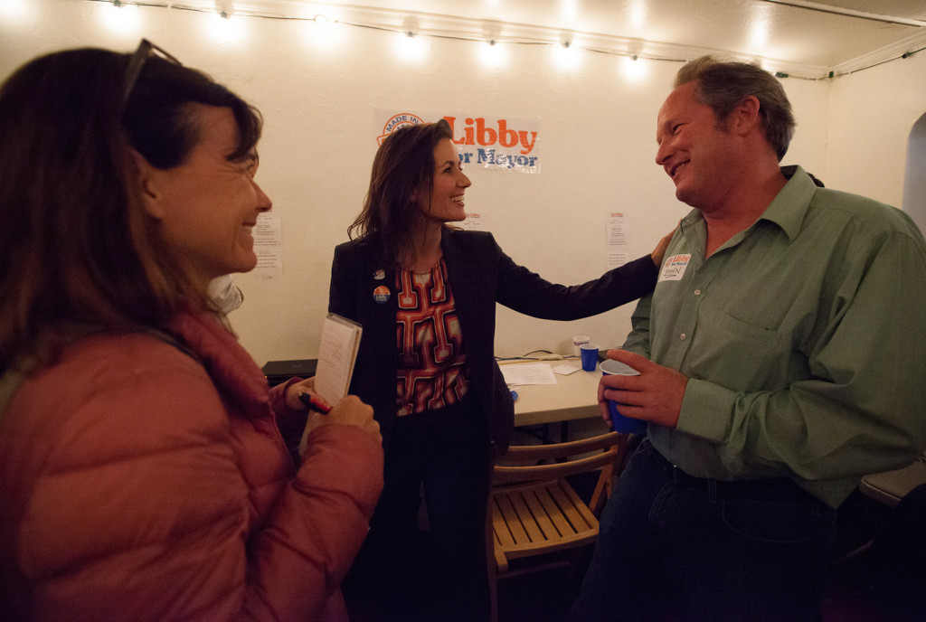 Voters, supporters and volunteers crowd around Schaaf to offer congratulations on the early results. Photo by Gina Pollack.