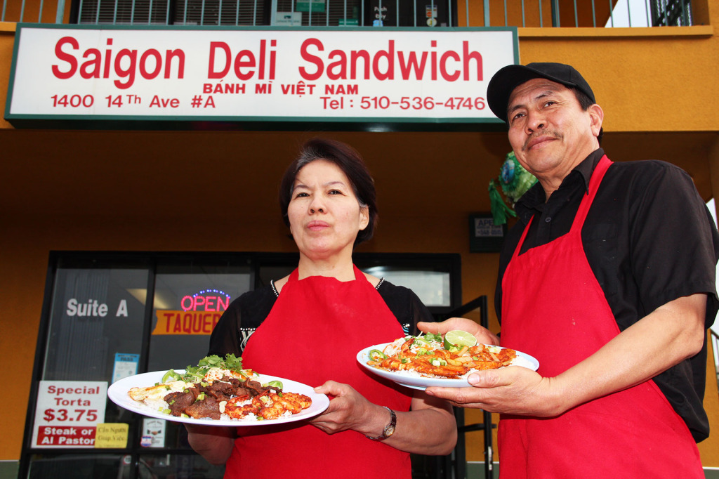 Co-owners Dieu Thi Ngo and Tony Torres pose before Saigon Deli (& Taco Valparaiso), a Vietnamese and Mexican restaurant they opened more than three years ago.