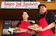 Co-owners Dieu Thi Ngo and Tony Torres pose before Saigon Deli (& Taco Valparaiso), a Vietnamese and Mexican restaurant they opened more than three years ago.