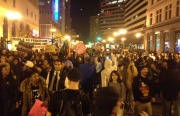 A crowd gathers in downtown Oakland to protest the grand jury's decision not to indict a police officer in the death of Michael Brown. Photo by Alex Kekauoha.