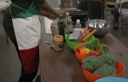 HuNia Bradley assembles ingredients for the Cooking Matters participants to put together a noodle salad at Alameda Point Collaborative on Nov. 13. Photo by Vanessa Reyes Walker.