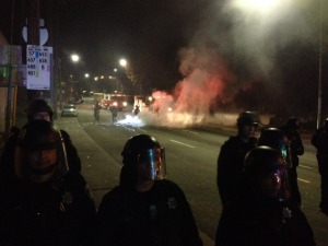 Firefighters arrive to put out a small trash fire started by protesters. Photo by Alex Kekauoha.