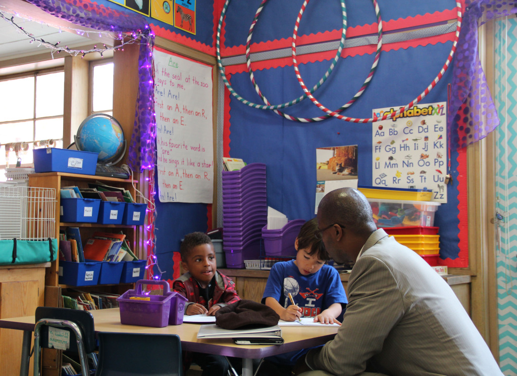 Kindergarteners Kimani and Quinn tell Oakland's superintendent Antwan Wilson about their studies. Wilson visited their classroom at Hillcrest Elementary School on a recent Tuesday.