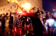 At the intersection of 14th and Broadway, protestors chanted “Hands up, don’t shoot.”