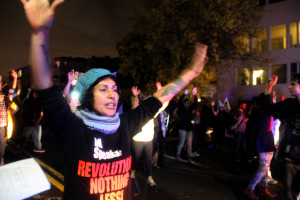 Demonstrators marched toward police lines with their hands up.