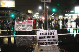 Many dispersed when the rain became a downpour, but several hundred marched on.