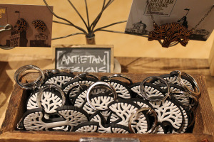 Oakland logo earrings made by Antietam designs share space with Oaklandish logo keychains. Antietam is one of 240 independent artists that have contracted to sell their wares at Oaklandish.