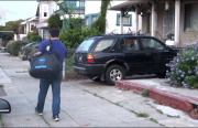 Mehdi Shokouhi, a Washio driver, delivers laundry to an Oakland customer who ordered the service through an app.