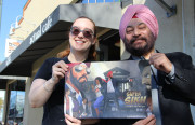 Eileen Alden and Supreet Singh Manchanda hold a poster of Super Sikh they created to support their KickStarter campaign.