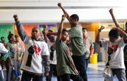 Young 'kings' remember the black panther party with fists in the air. (Photo by Candese Charles)