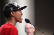 Kyle McCoy, an Oakland resident and activist with Black Lives Matter, calls for more accountability for police-involved shootings. Photo by Lucas Waldron.