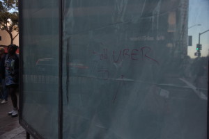 Hours after Uber Technologies Inc. announced purchase of the former Sears building, 1955 Broadway, Oakland, a passerby scribbled the news in permanent marker on a widow of the building facing Broadway. Photo: Jennifer Glenfield