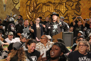 Raiders fan Gary Dowell spars with Raiders owner Mark Davis (not pictured) from across the theater.
