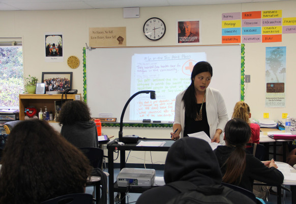 Leona Kwon, the ethnic studies teacher at Castlemont High School, explains an assignment to her students.