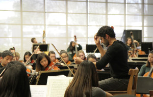 Omid Zoufonoun directs members of the Oakland Symphony Youth Orchestra.