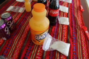 At the Oakland v. Big Soda campaign headquarters, a demonstration shows how much sugar is in a bottle of Sunny D orange juice.
