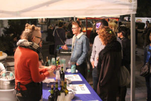 Attendees order drinks in cat-themed attire.