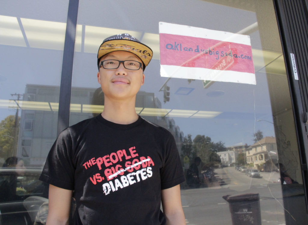 Roger Saechao, 25, a fellow with The Organizing and Leadership Academy, knocked on doors Saturday morning for the 'Oakland vs. Big Soda' campaign in support of Measure HH, a one-cent-per-ounce tax on sugar-sweetened beverages in Oakland.