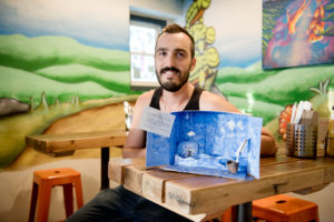 Jeremy Dalmas with his diorama of 'The Wizard of Earthsea' by Ursula K. Le Guin. Photo by Rosa Furneaux.