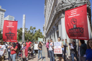 Demonstrators outside Oakland City Hall took part in the national Renter's Day of Action.
