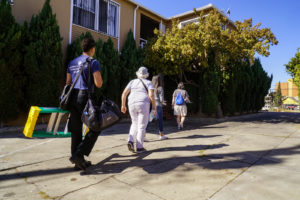 The American Red Cross and the Oakland Fire Department knocked on Fruitvale residents’ homes to install and inspect new smoke alarms as part of the initiation of their Home Fire Preparedness Campaign on Saturday, October 8, 2016. (Yesica Prado/Oakland North)