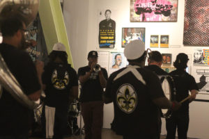 MJ’s Brass Boppers performs a New Orleans-style second line procession for Betti Ono’s sixth anniversary celebration. Photo by Briana Flin.
