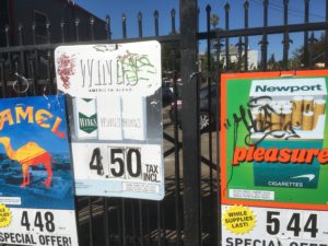 Cigarette advertisements outside of Cypress Grocery in West Oakland.