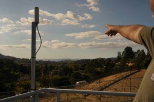 Sobrante Treatment Plant supervisor, Bryan Miller, points to the distant North Reservoir, a finished water reservoir where it waits for distribution.