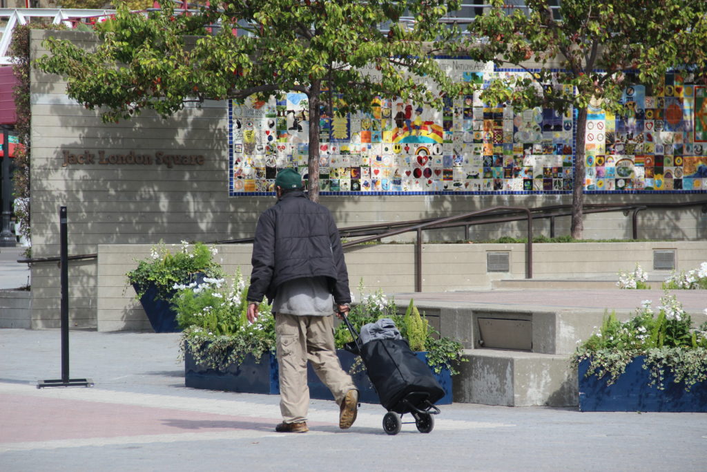 Oakland resident walks around Jack London Square enjoying the weather.
