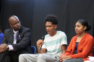 Lavoshia Ivy, a senior at Castlemont, recounts the power of an understanding teacher as Superintendent Wilson and Castlemont senior Nicole Funes look on.