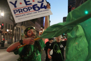 Chris Conway, left, is a Colorado resident who came west to show his support for cannabis legalization. Lauren Vasquez, left, organized the downtown Oakland rally to educate voters on the importance of ending cannabis prohibition. Photo by Nate Shiedlower.