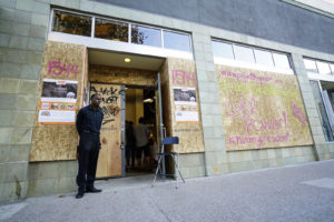 Joshua Gause, security guard of 1544 Events, guards the door during the "Hope Art" project on Sunday, November 11, 2016. (Yesica Prado/Oakland North)