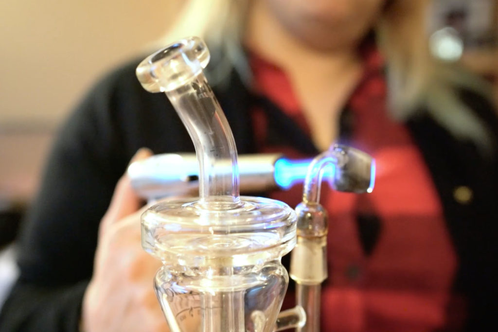 Dani Geen preps her quartz nail for dabbing, her method of taking cannabis for fibromyalgia and chronic pain.