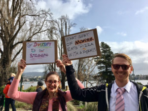 Marchers wave their signs near Lake Merritt at the start of the march. Photo by Akira Olivia Kumamoto.