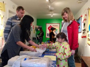 100 days of Action artists gather at the Royal Nonesuch Gallery in Oakland hosting a protest banner making workshop with artist Stephanie Syjuco on Sunday, January 8, 2017. (Photo courtesy of 100 Days Action)