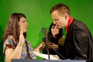 Maysoun Wazwaz takes a presidential oath to "faithfully execute her role as Boss Lady of the United States" in front of "judge" and artist Jeremiah Barber at the Royal Nonesuch Gallery at the Inauguration Ball on Friday, January 20, 2017. (Photo courtesy of 100 days Action-Victoria Heilweil)