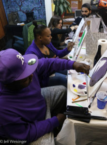 Class participants (left to right) Anthony, his wife (in purple), Sadaf Tabatabai and Abdullah Khan focus on their work. (Photo Jeff Weisinger)