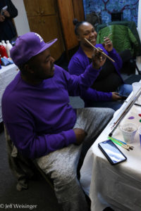 Anthony and his wife compare blunts after taking a break from painting. (Photo Jeff Weisinger)