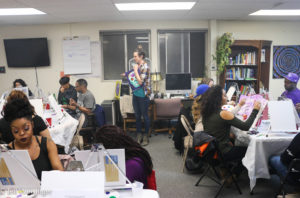 Artist and founder Heidi Keyes speaks to her class. (Photo Jeff Weisinger)