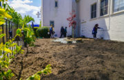 Volunteers gather at the Memorial Tabernacle Church for a lawn party to restore the church's garden on Saturday, May 6, 2017. (Yesica Prado/Oakland North)