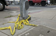 Automobile debris and crime scene tape remained at the intersection of Cortland and Foothill early Friday morning near where an Oakland police officer tasered a man. Photo by Brian Krans.