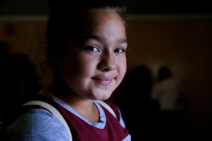Che-Kwis Hernandez, 12, spoke to a room full of East Oakland residents about her experiences as a witness to sex trafficking in her neighborhood. She spoke during the first annual East Oakland Congress of Neighborhoods assembly at the International Community School on International Boulevard. Photo by Lisa Hornak