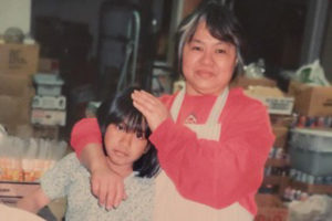 Nina Castro Cruz, age nine, with her mother, Adelaida Castro, summer 1993. “I worked in the stockroom packaging our bulk item products,” Castro Cruz says.