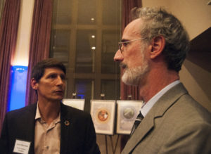 Jason Morrison (left), the president of the Pacific Institute, and Peter Gleick, co-founder, president emeritus and chief scientist of the group, talk during Pacific Institute's 30th anniversary party. Gleick stepped down from leading the organization in 2016 after running it for 29 years.